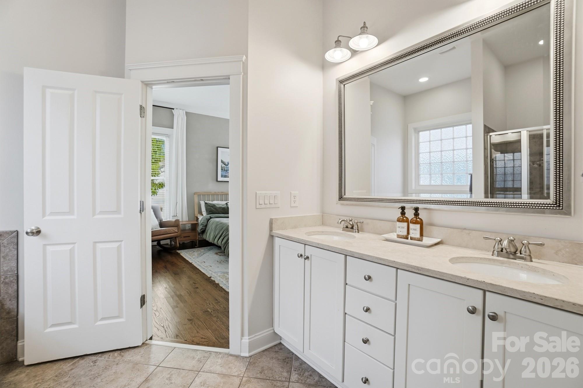 4333 Birkshire Heights Fort Mill, SC 29708 - Photo 23 of 48 a spacious en suite bathroom with double sink and a mirror