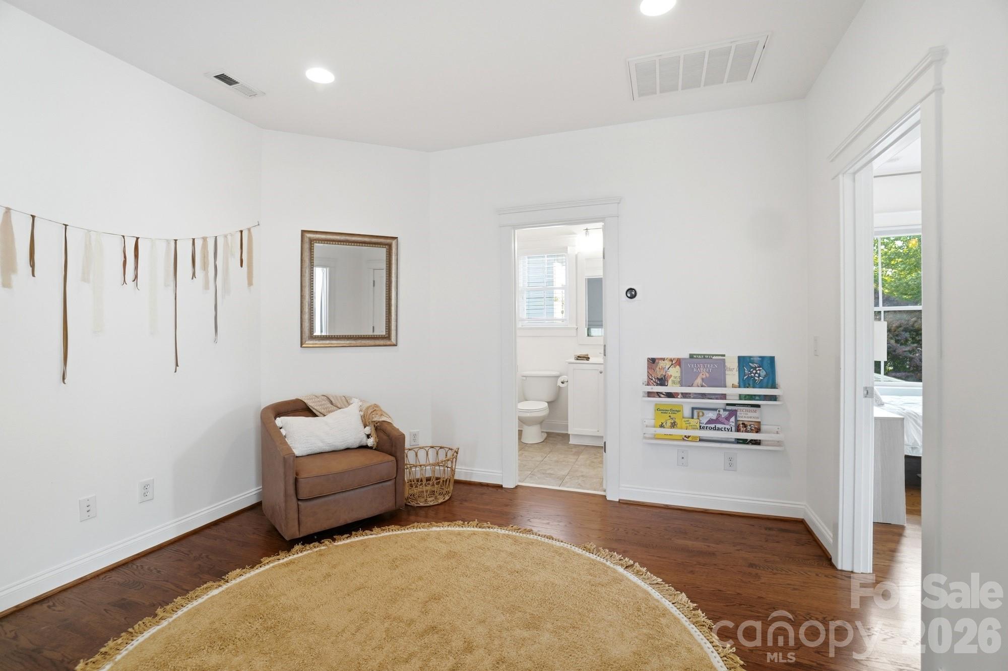 4333 Birkshire Heights Fort Mill, SC 29708 - Photo 29 of 48 a living room with furniture and a wooden floor