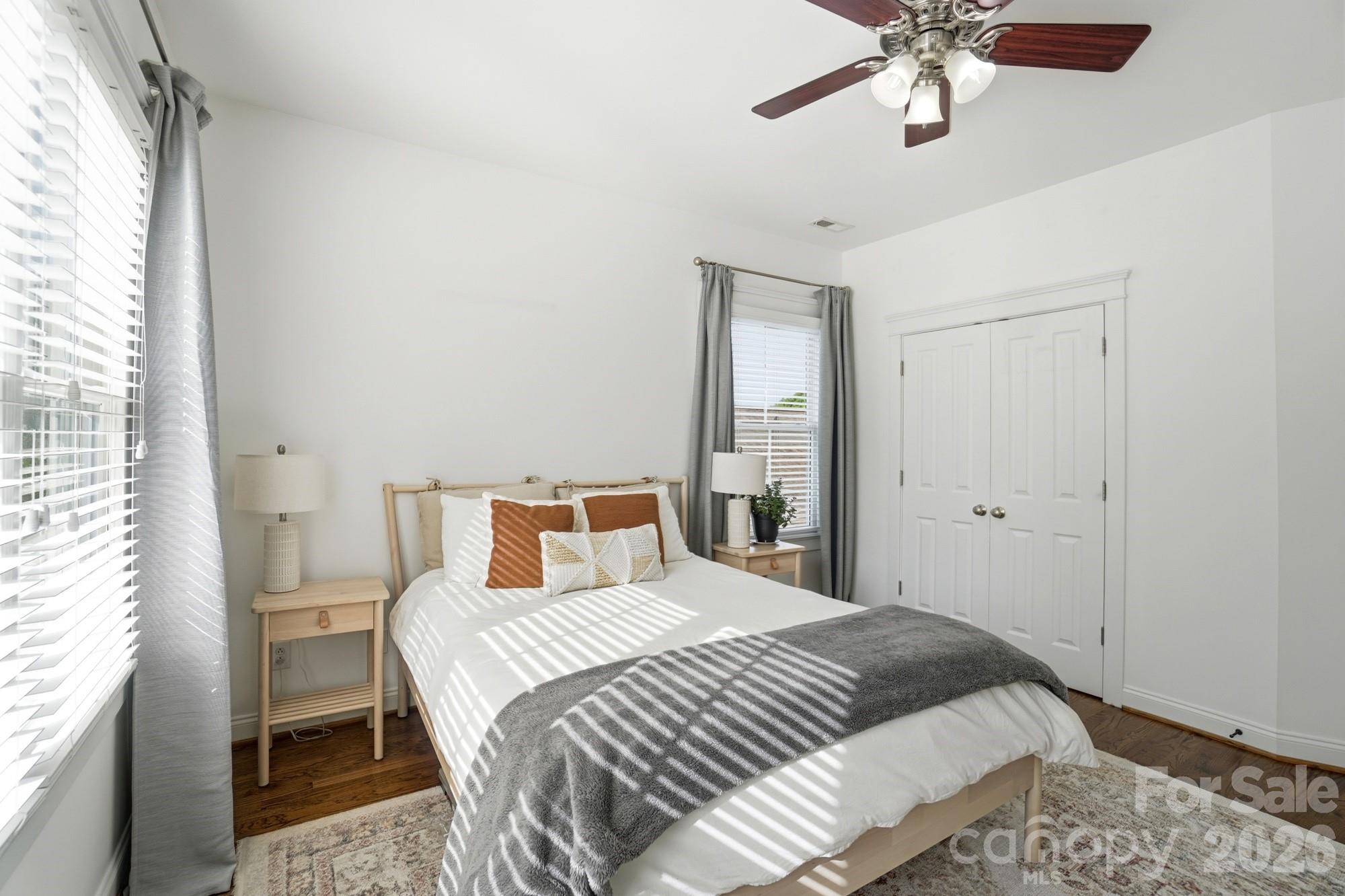 4333 Birkshire Heights Fort Mill, SC 29708 - Photo 31 of 48 a bedroom with a large bed and a chandelier