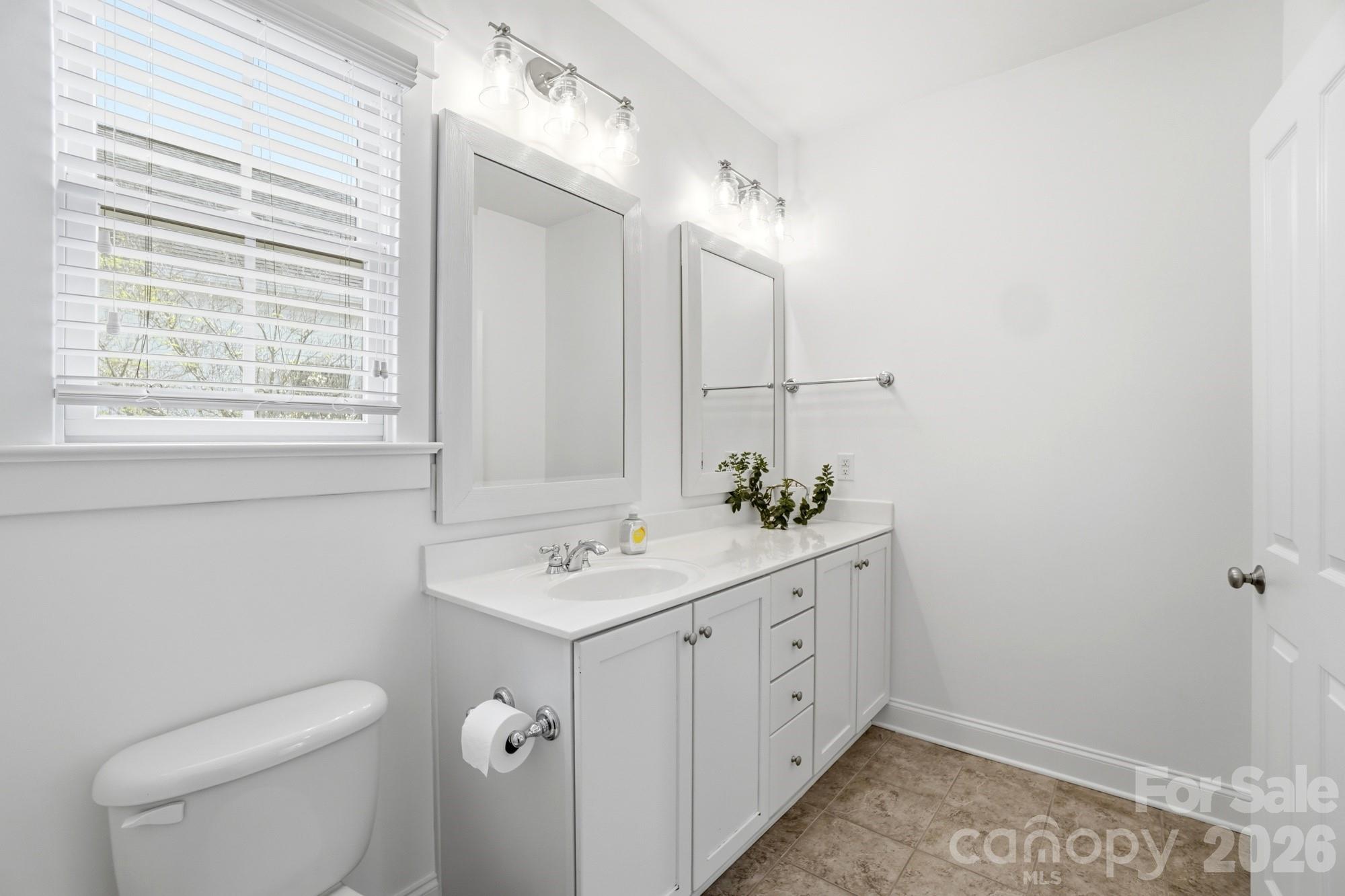4333 Birkshire Heights Fort Mill, SC 29708 - Photo 38 of 48 a bathroom with a toilet sink and mirror