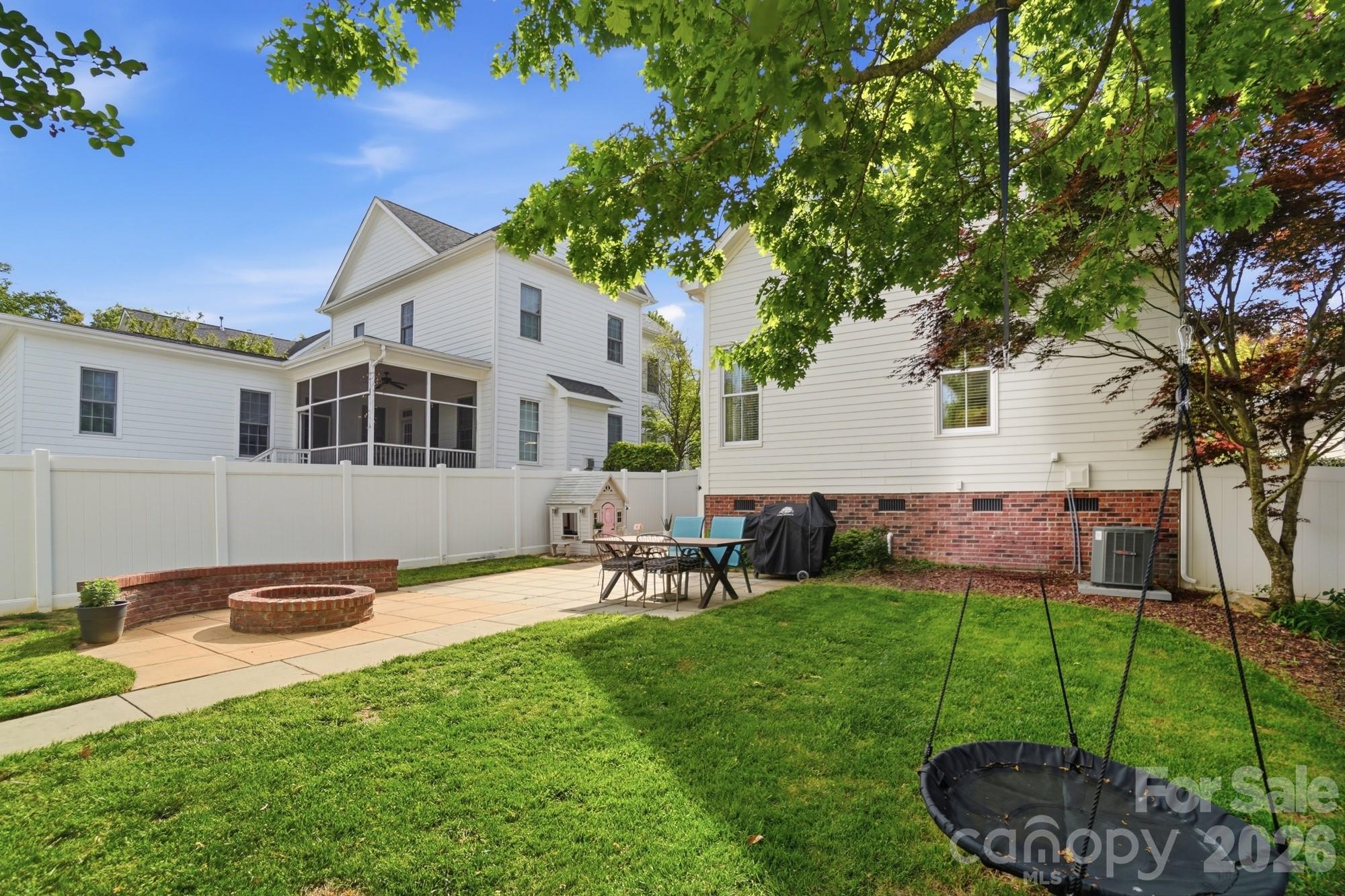 4333 Birkshire Heights Fort Mill, SC 29708 - Photo 45 of 48 a backyard of a house with table and chairs