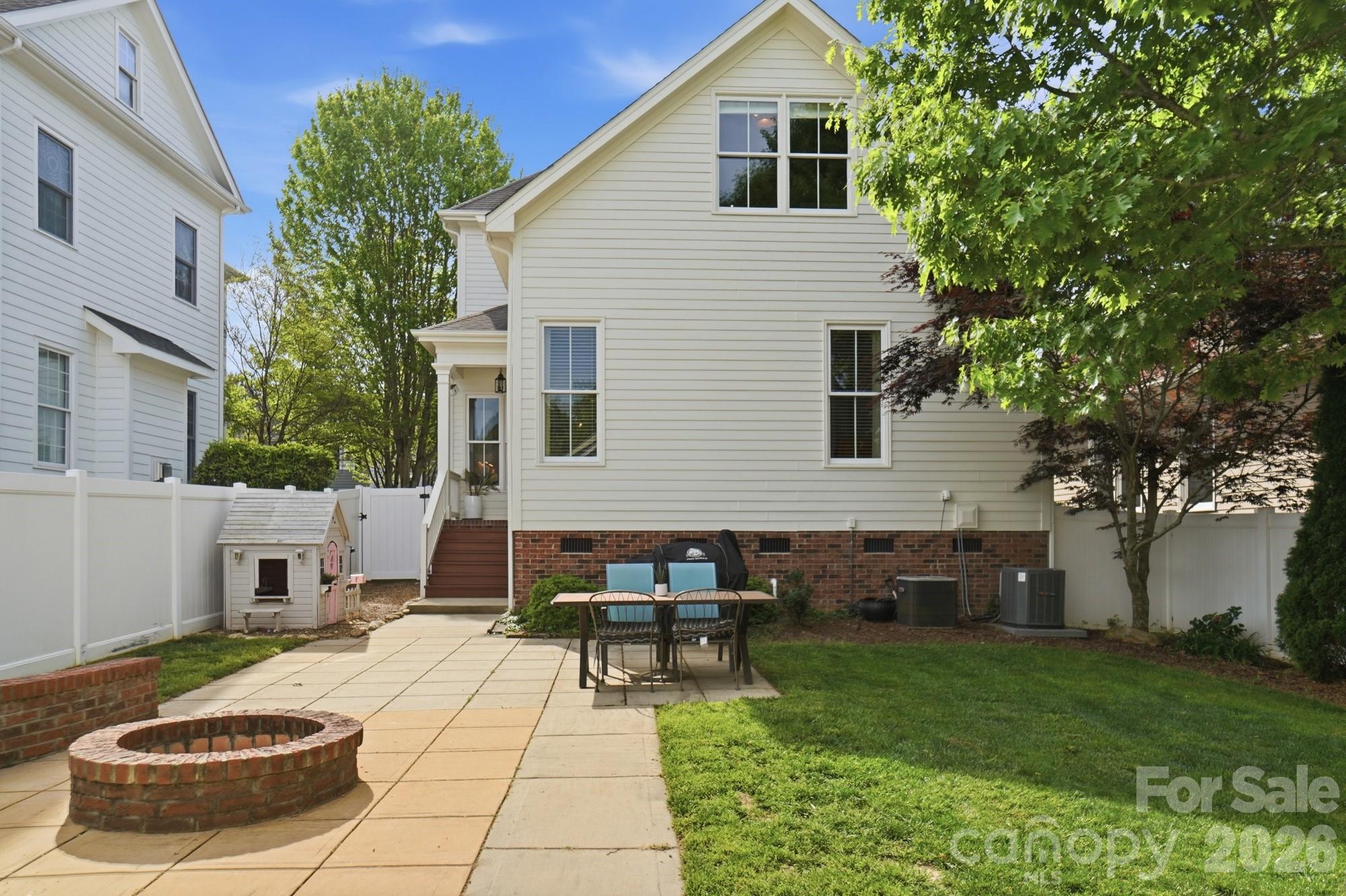 4333 Birkshire Heights Fort Mill, SC 29708 - Photo 47 of 48 a backyard of a house with table and chairs