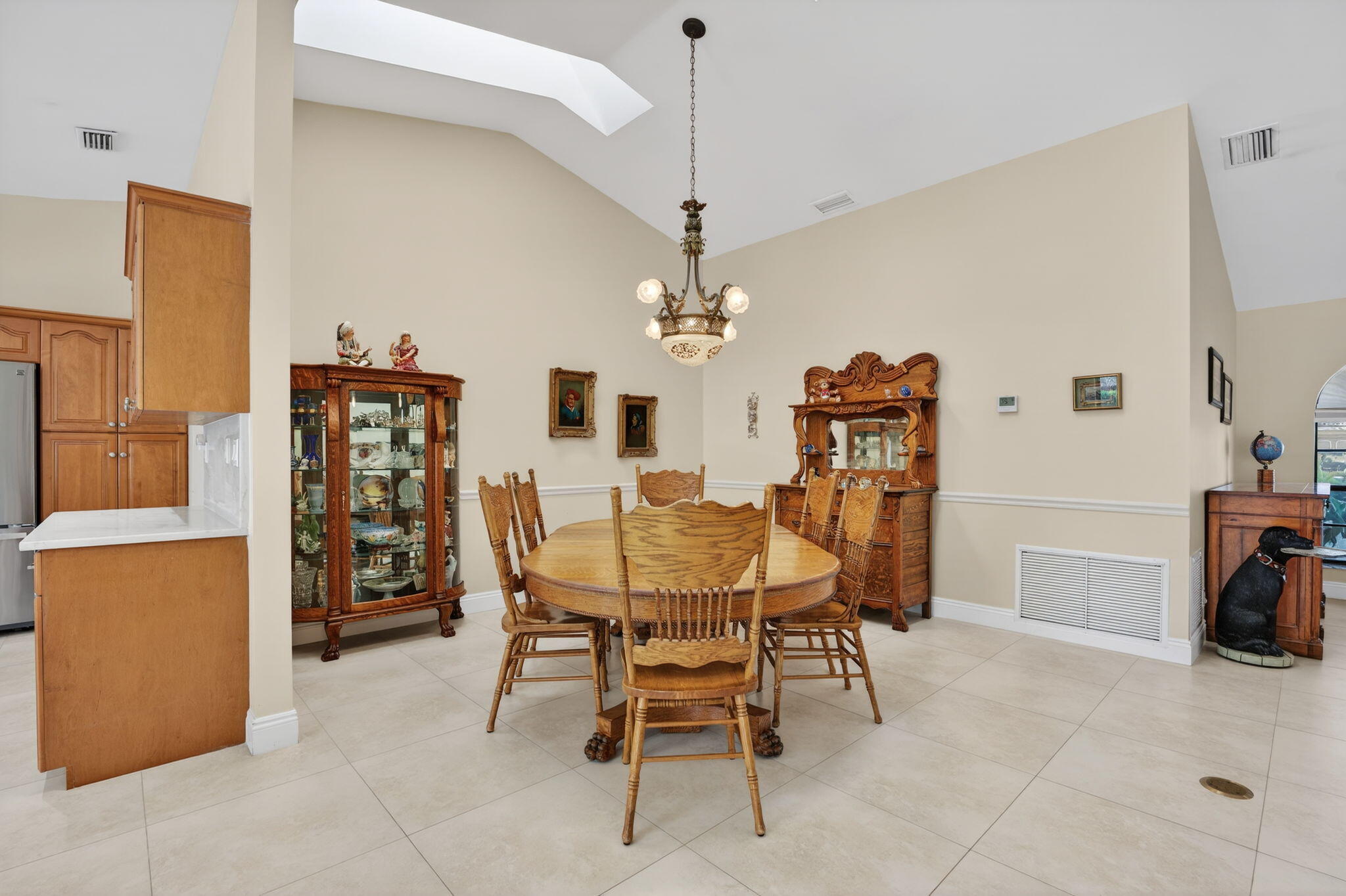 5111 Northwest 85th Road Coral Springs, FL 33067 - Photo 12 of 47 a dining room with furniture and chandelier