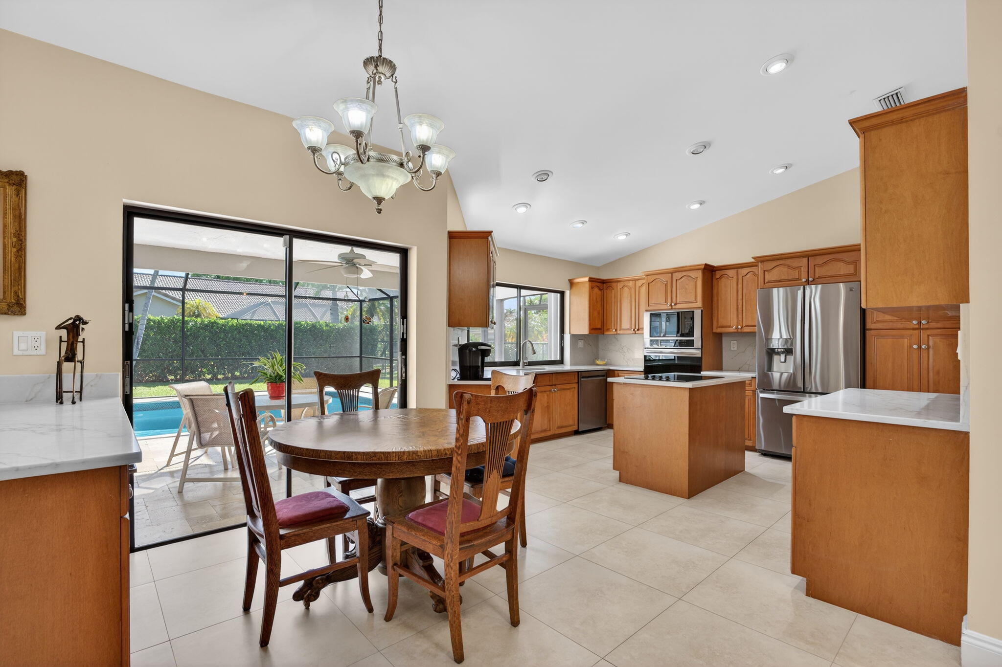 5111 Northwest 85th Road Coral Springs, FL 33067 - Photo 13 of 47 a dining room with furniture a chandelier and window