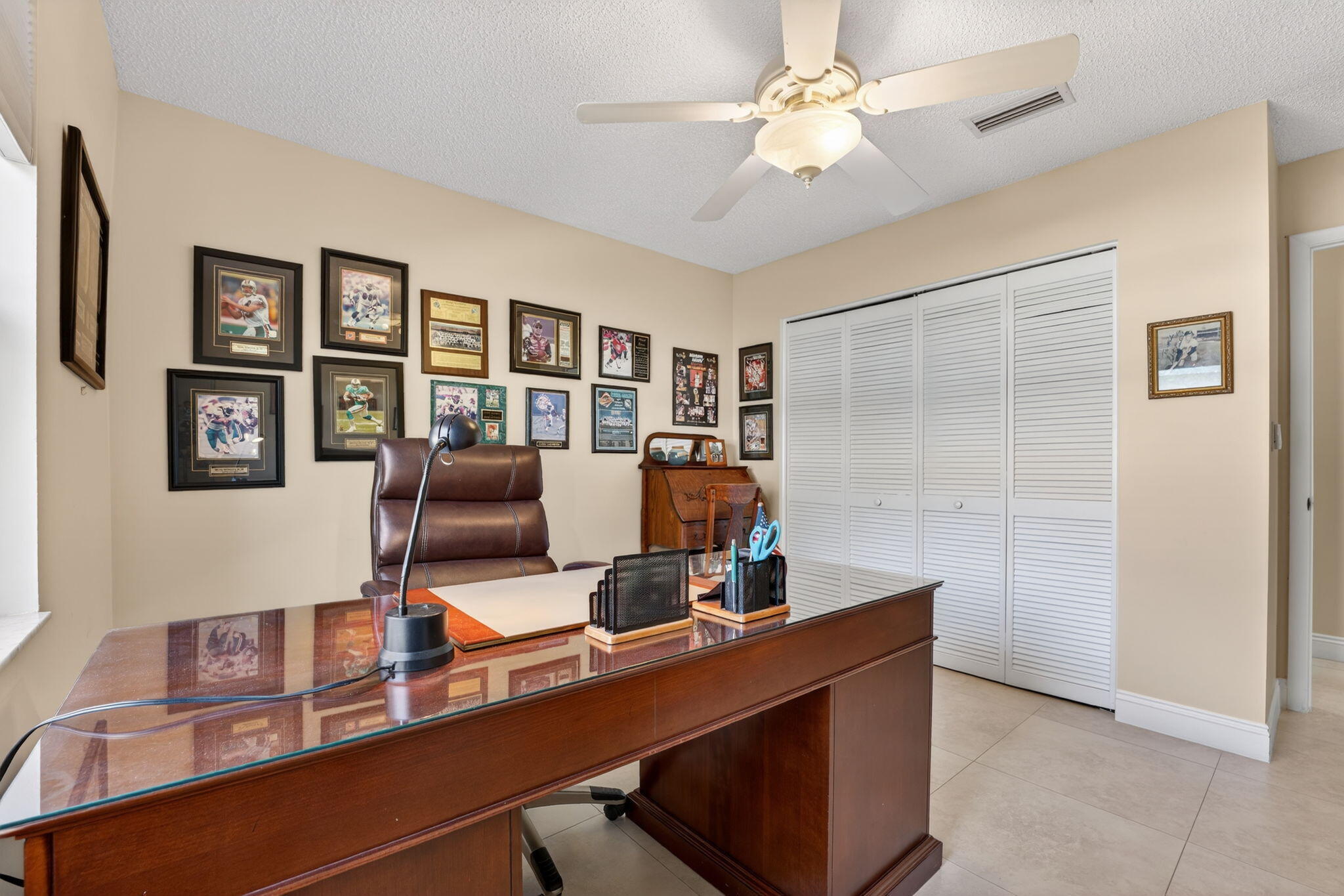 5111 Northwest 85th Road Coral Springs, FL 33067 - Photo 29 of 47 a view of a workspace with furniture and a window