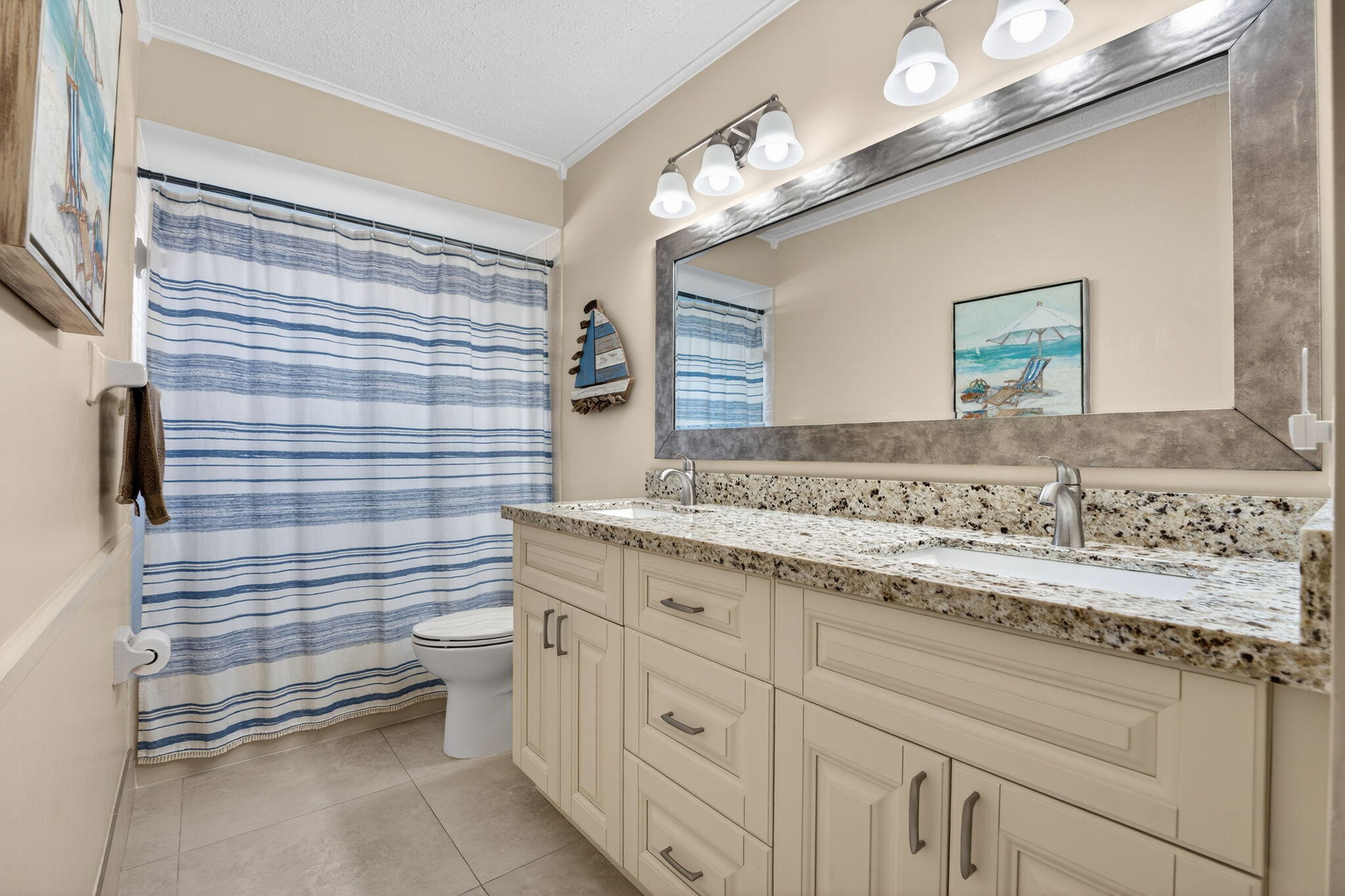 5111 Northwest 85th Road Coral Springs, FL 33067 - Photo 33 of 47 a bathroom with a sink and a mirror