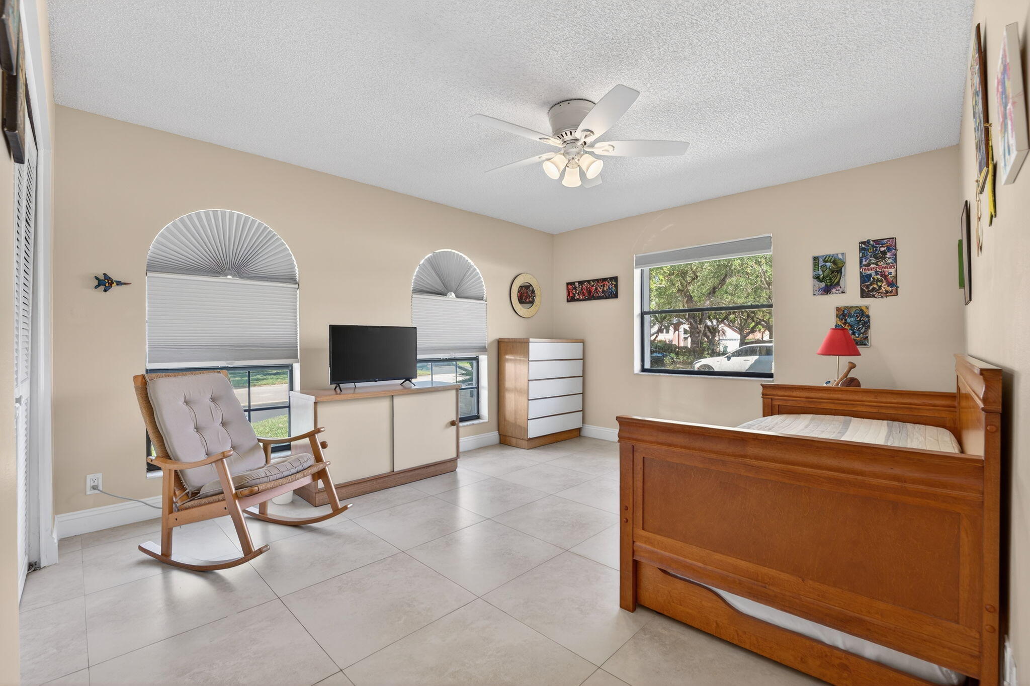 5111 Northwest 85th Road Coral Springs, FL 33067 - Photo 34 of 47 a living room with furniture and a flat screen tv