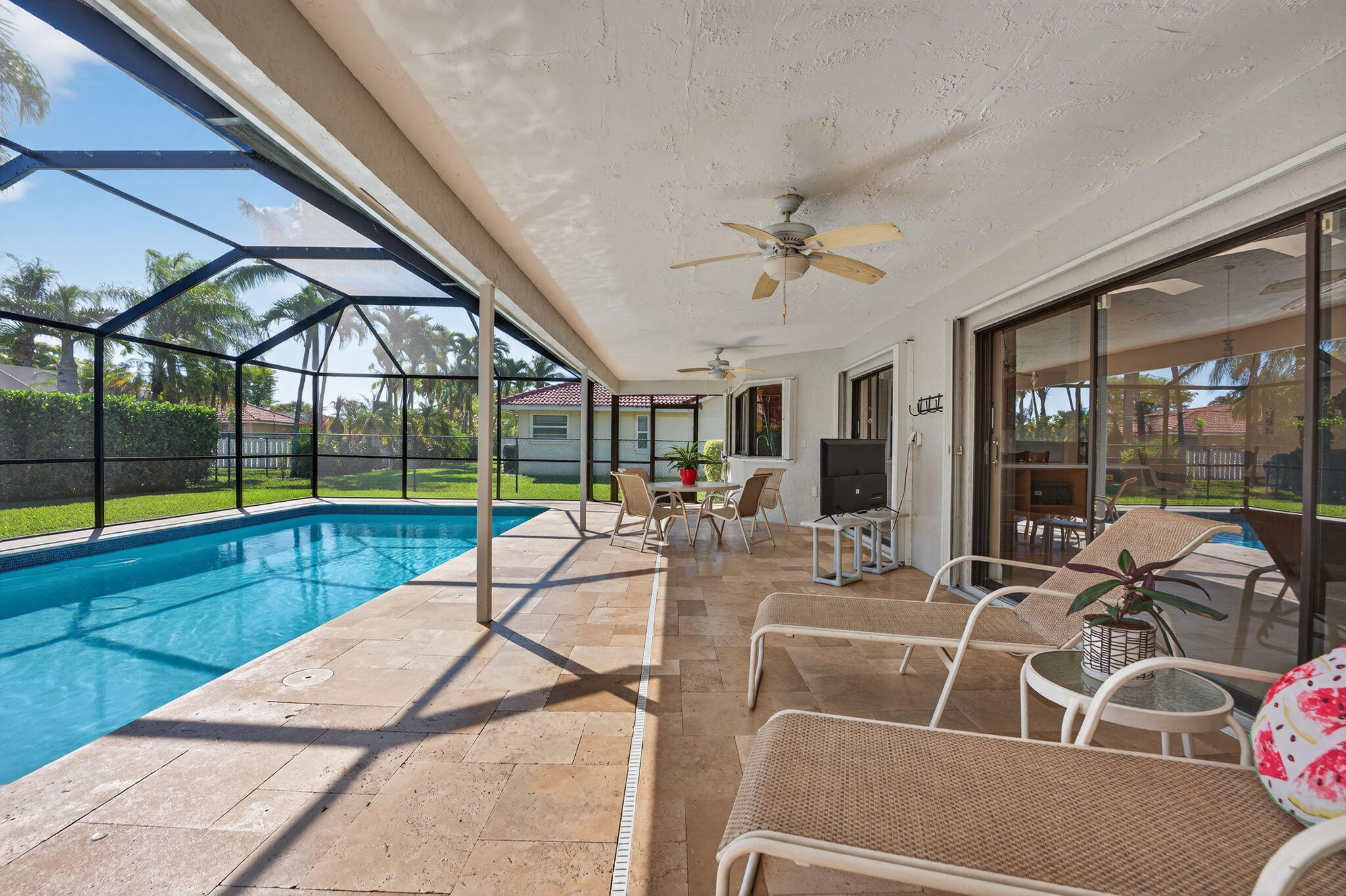 5111 Northwest 85th Road Coral Springs, FL 33067 - Photo 37 of 47 a view of a house with swimming pool and porch with a backyard