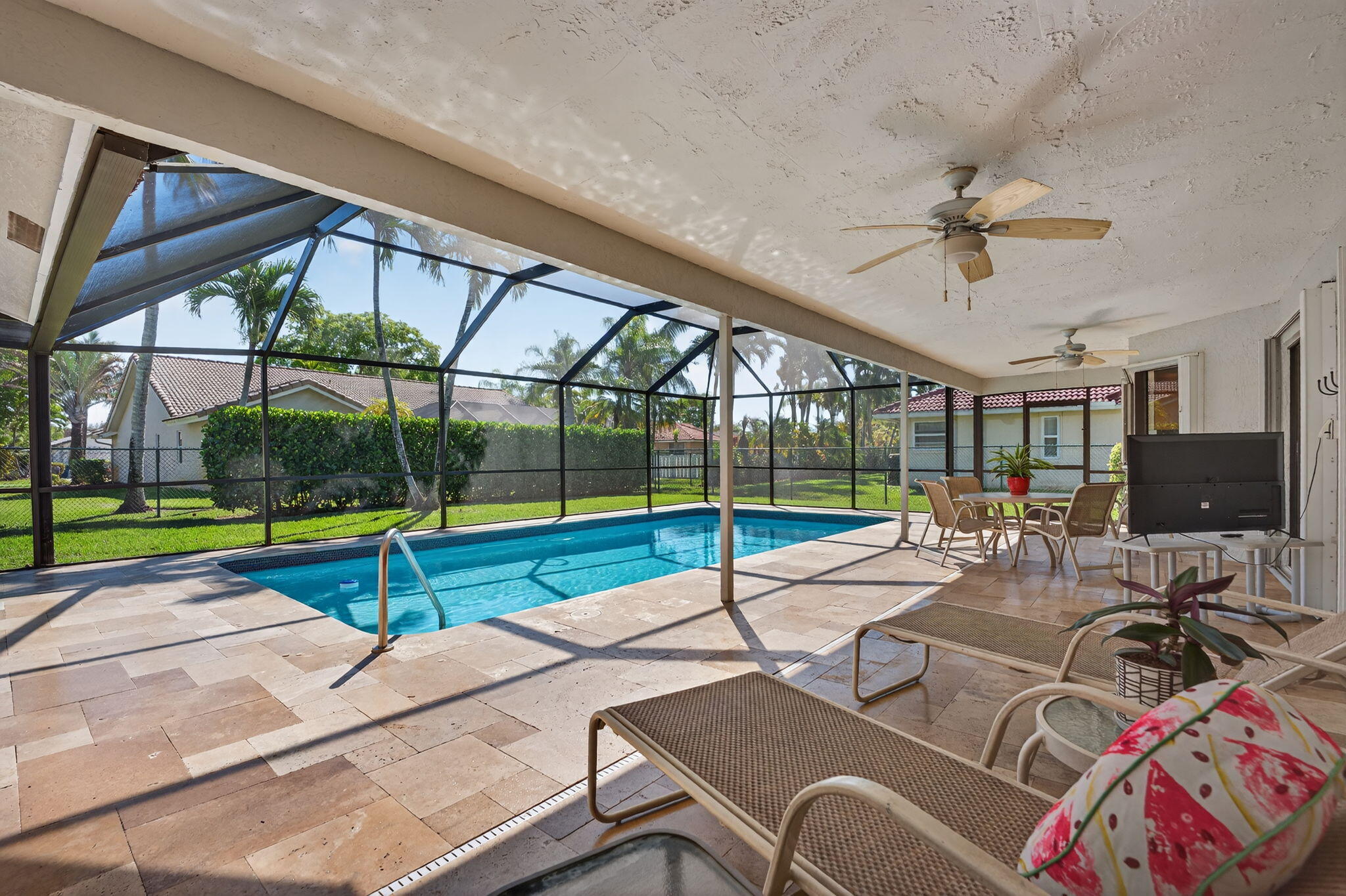 5111 Northwest 85th Road Coral Springs, FL 33067 - Photo 38 of 47 a view of a patio with a table and chairs
