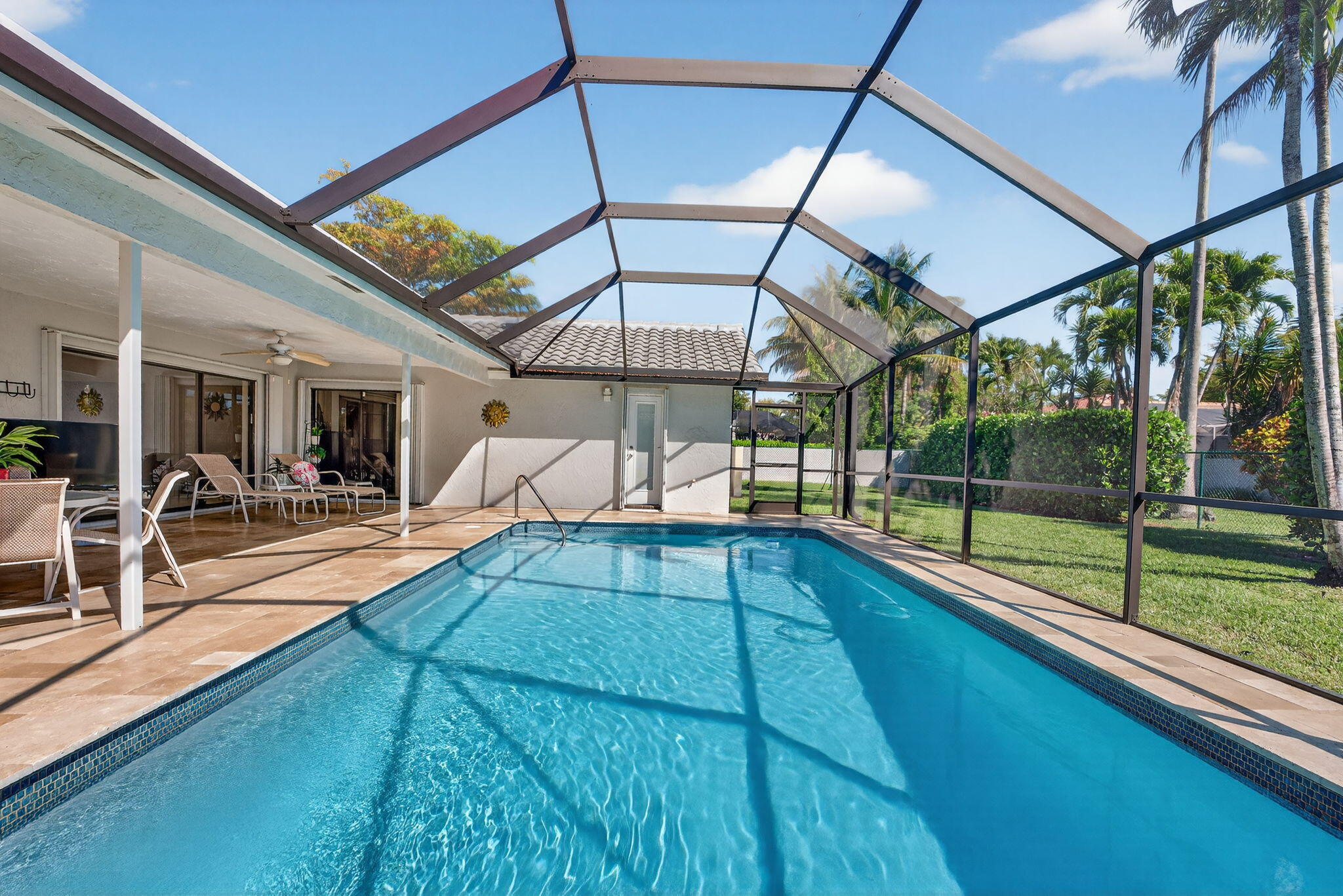 5111 Northwest 85th Road Coral Springs, FL 33067 - Photo 40 of 47 a view of swimming pool with seating area