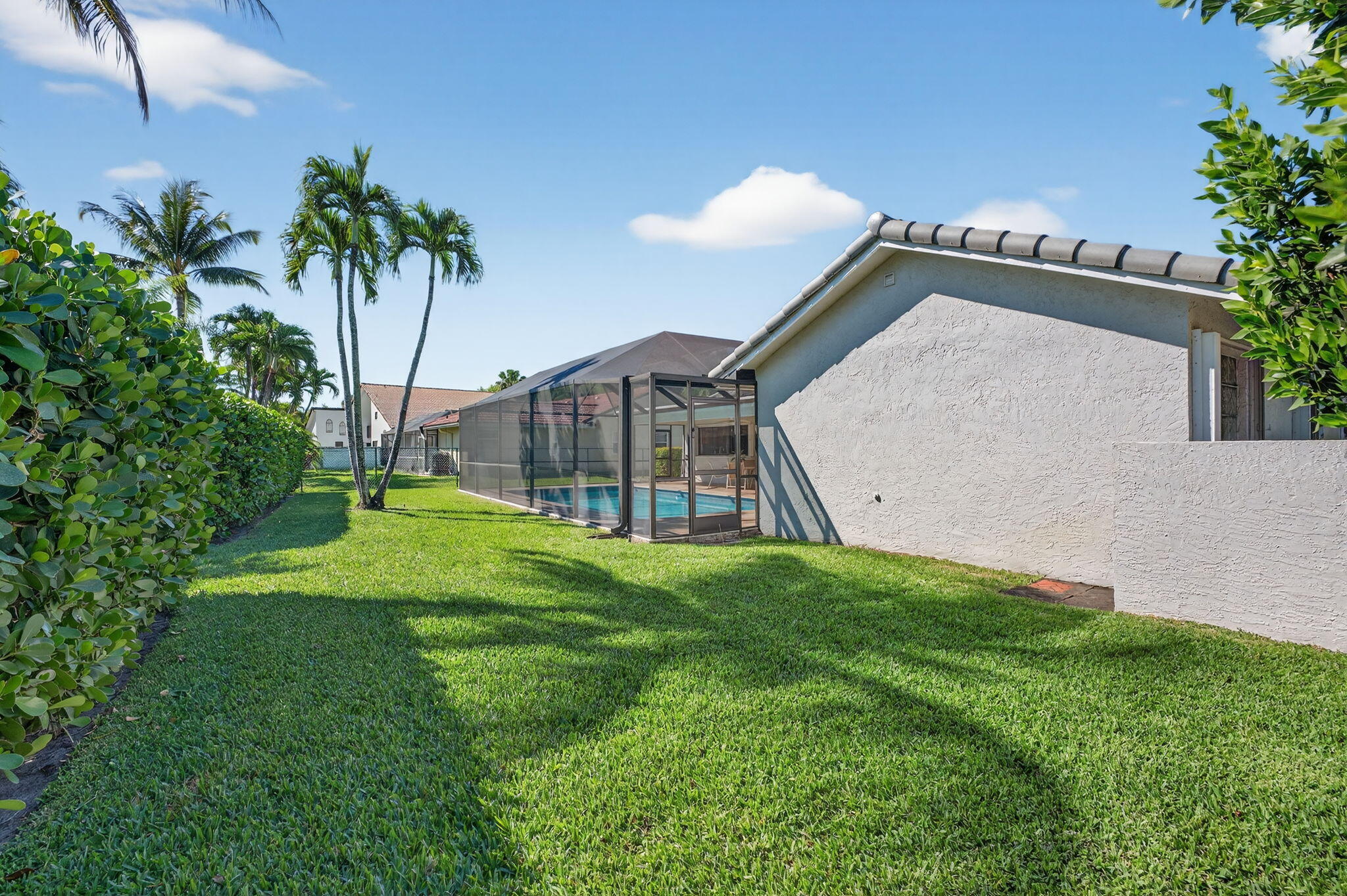 5111 Northwest 85th Road Coral Springs, FL 33067 - Photo 43 of 47 a view of a house with a yard and a garden