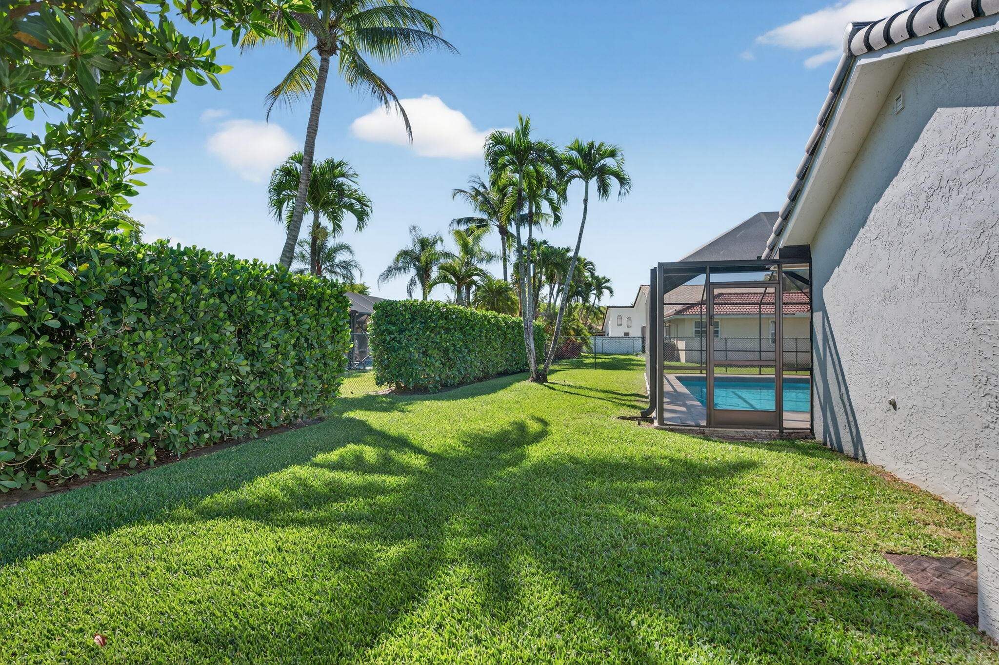 5111 Northwest 85th Road Coral Springs, FL 33067 - Photo 45 of 47 a view of a backyard with a garden
