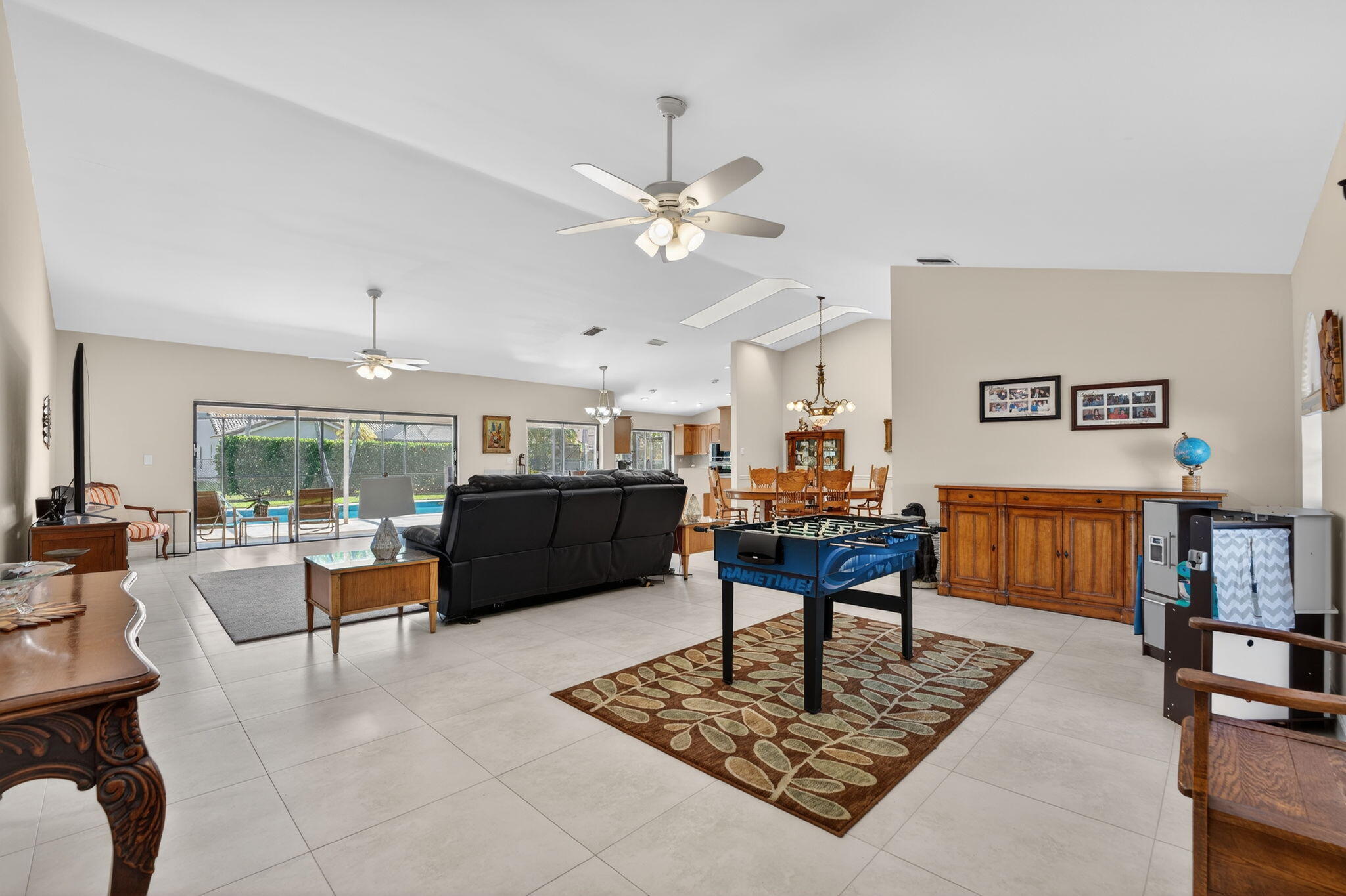 5111 Northwest 85th Road Coral Springs, FL 33067 - Photo 5 of 47 a living room with furniture and a chandelier