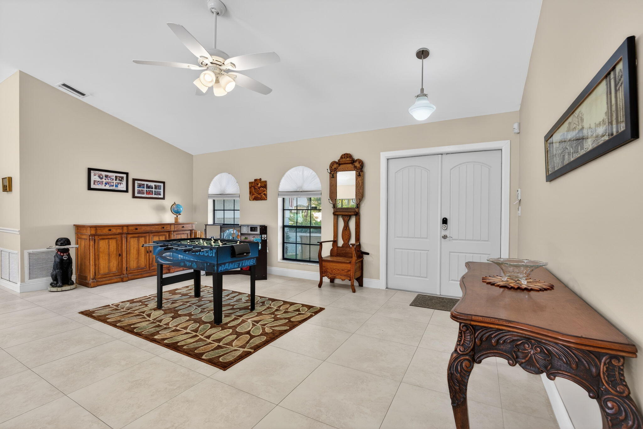 5111 Northwest 85th Road Coral Springs, FL 33067 - Photo 6 of 47 a living room with furniture and a chandelier