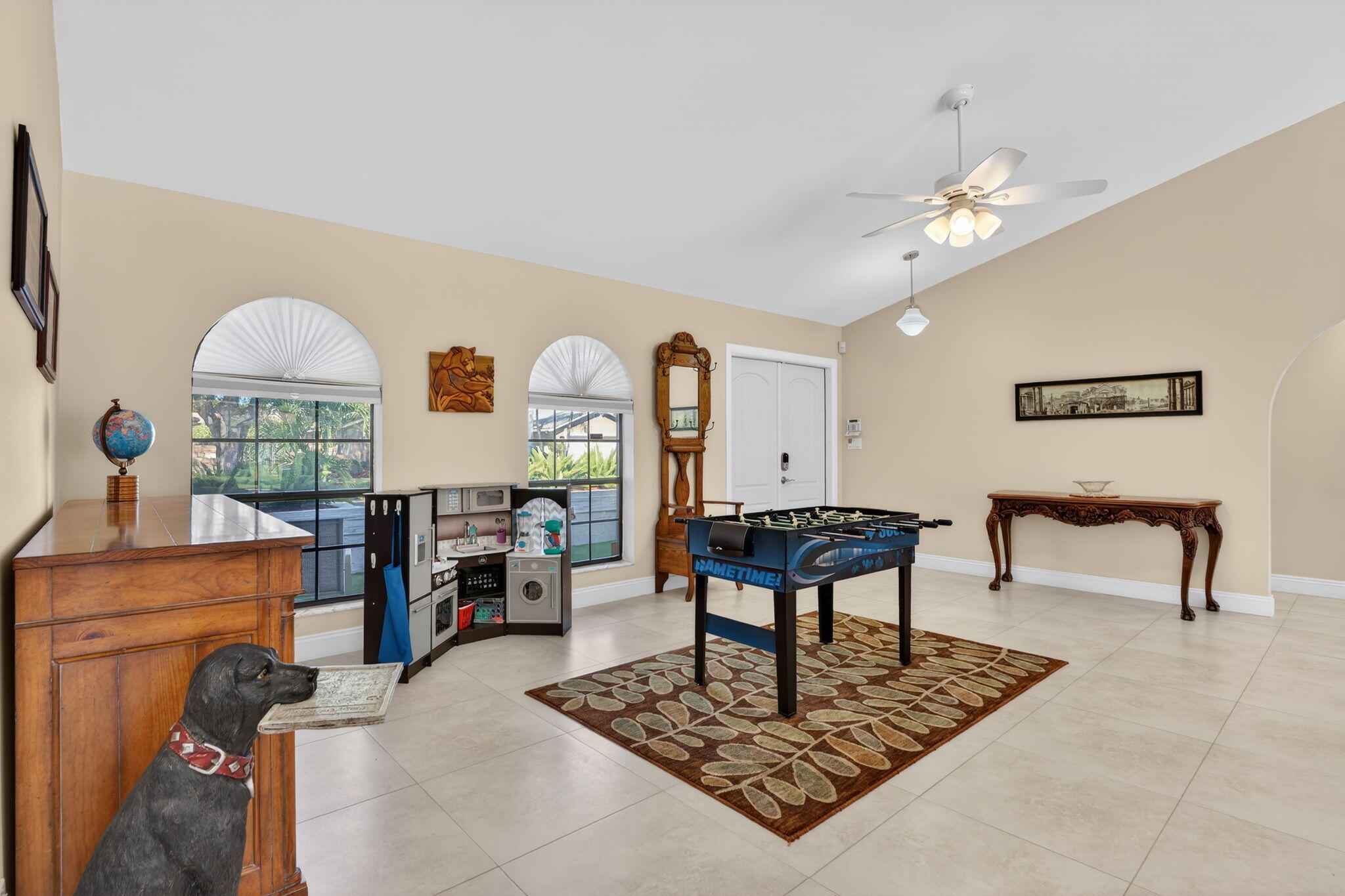 5111 Northwest 85th Road Coral Springs, FL 33067 - Photo 7 of 47 a living room with furniture and a chandelier