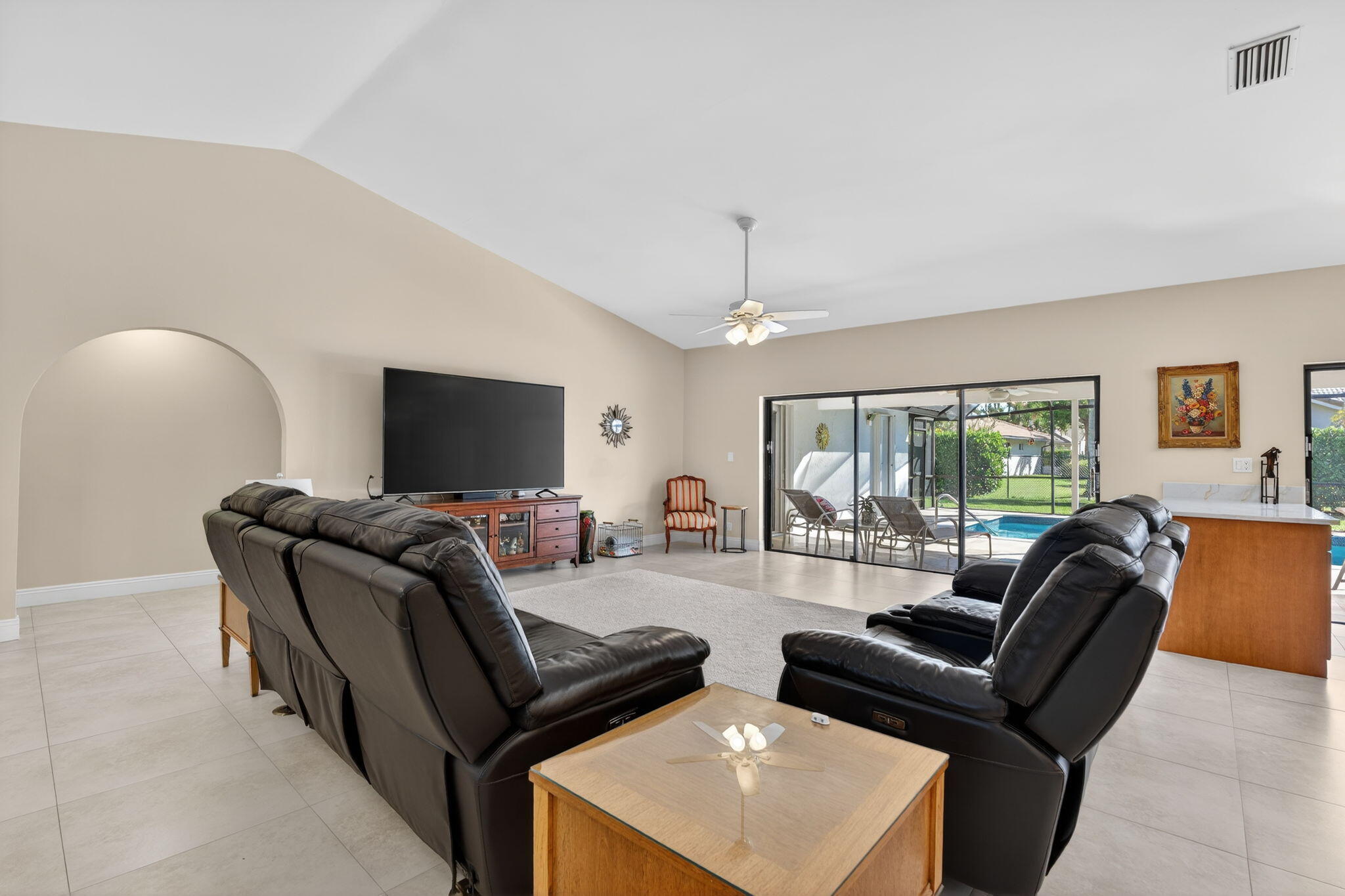 5111 Northwest 85th Road Coral Springs, FL 33067 - Photo 8 of 47 a living room with furniture and a flat screen tv