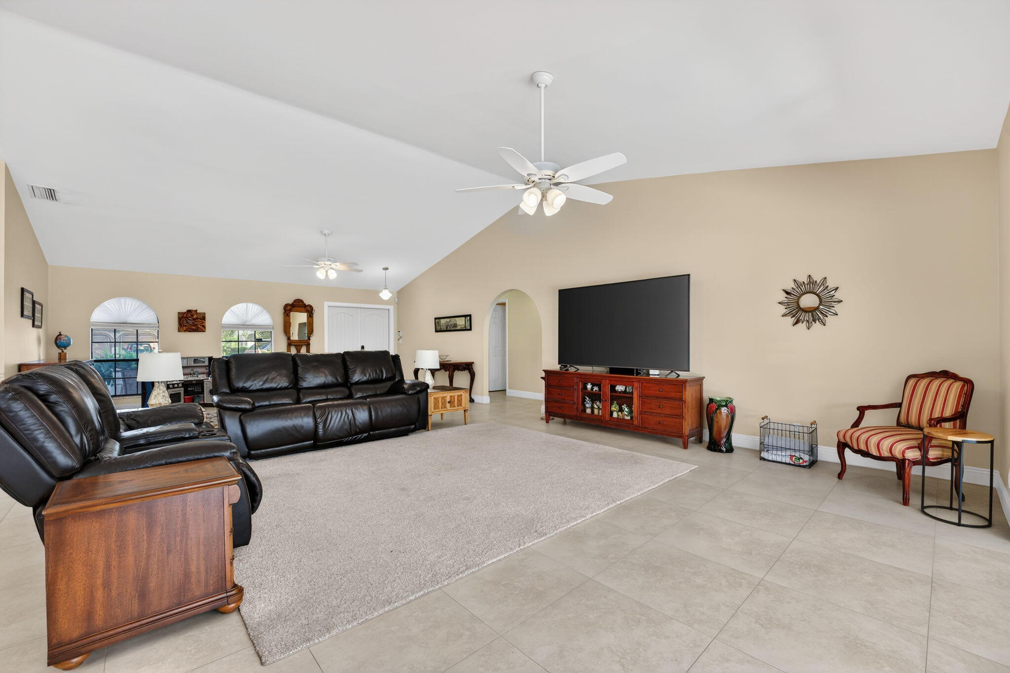 5111 Northwest 85th Road Coral Springs, FL 33067 - Photo 10 of 47 a living room with furniture and a flat screen tv