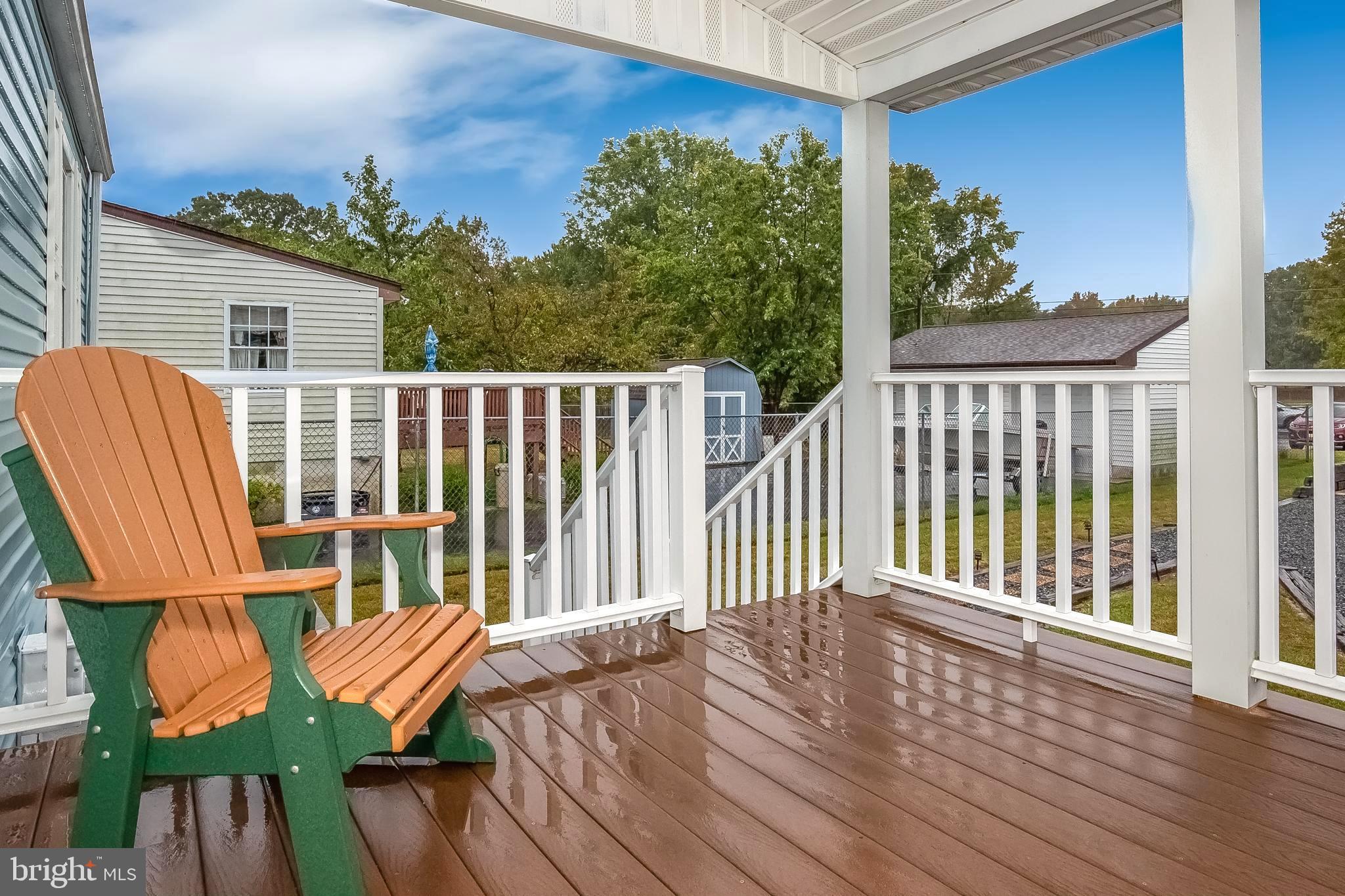 306 Sassafras Road Baltimore, MD 21221 - Photo 4 of 37 COVERED DECK LEADING TO REAR YD & 2-CAR GARAGE