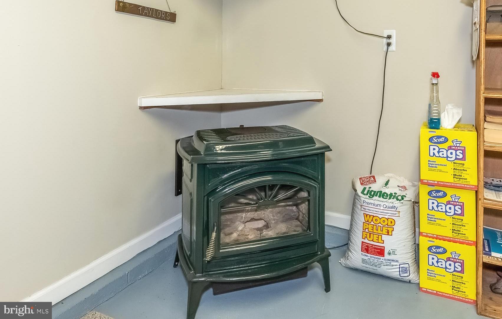 306 Sassafras Road Baltimore, MD 21221 - Photo 36 of 37 ENAMEL PELLET STOVE WARMS GARAGE BUILDING