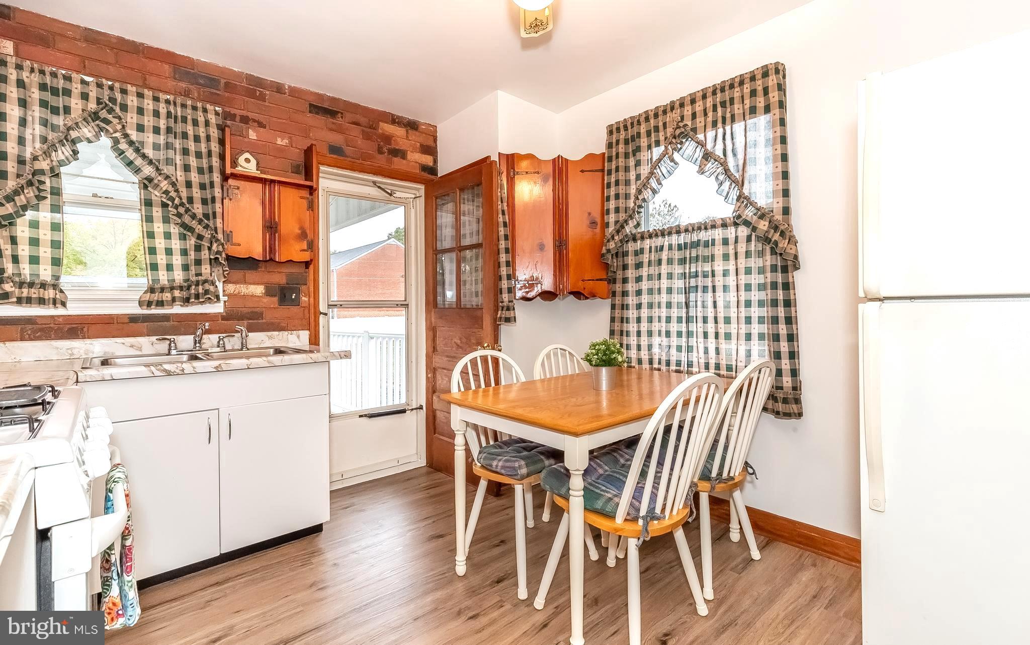 306 Sassafras Road Baltimore, MD 21221 - Photo 10 of 37 KIT/DINING AREA OPENS TO REAR DECK & YARD