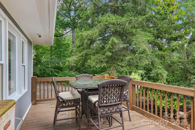 a view of balcony with furniture and wooden deck