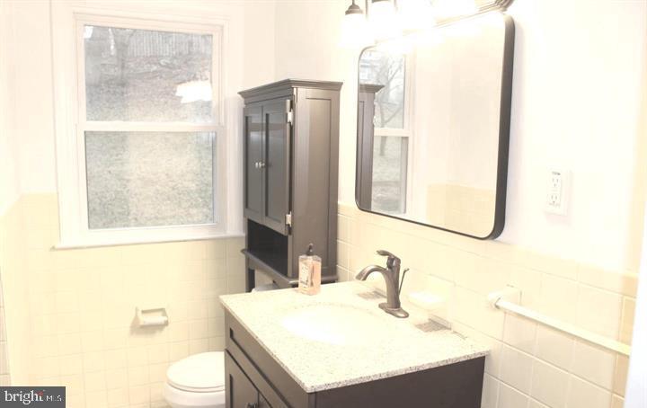 645 Glendale Road Havertown, PA 19083 - Photo 16 of 22 a bathroom with a sink vanity mirror and toilet