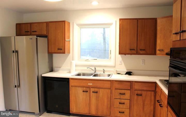 645 Glendale Road Havertown, PA 19083 - Photo 9 of 22 a kitchen with stainless steel appliances granite countertop a refrigerator and a sink