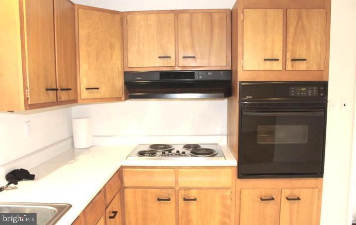 645 Glendale Road Havertown, PA 19083 - Photo 10 of 22 a kitchen with a stove and a microwave