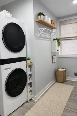 a view of a storage and utility room with a washer and dryer