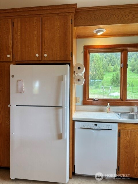 40 Turner Homestead Road Oroville, WA 98844 - Photo 8 of 27 a white refrigerator freezer sitting in a kitchen