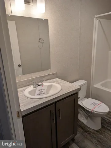 a bathroom with a sink and a toilet