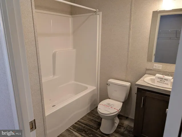 a bathroom with a sink and toilet