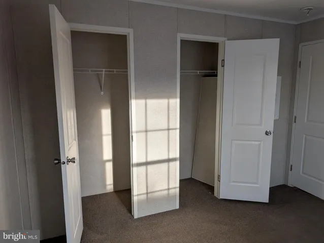 a view of empty room with closet