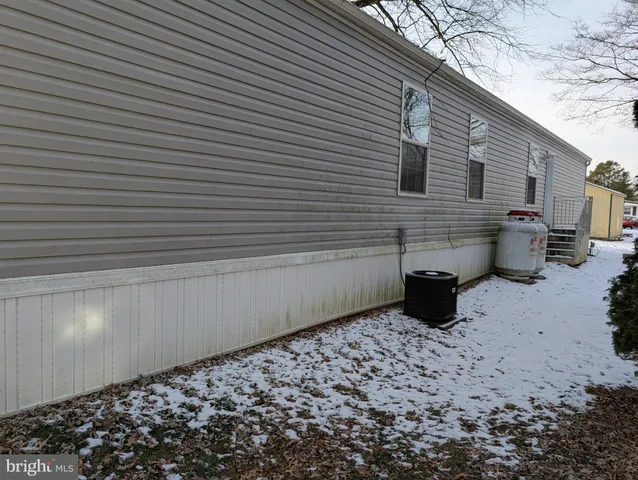 a view of a terrace with a wooden bench
