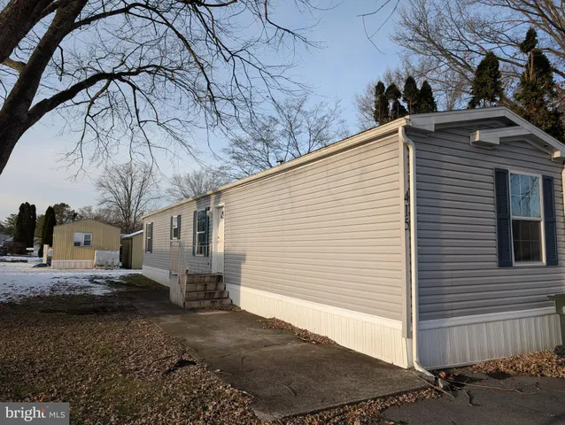 a view of a backyard with sitting area