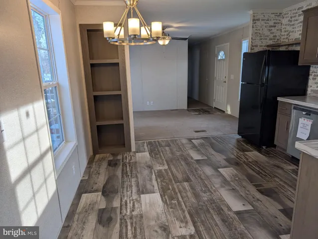 a view of a livingroom with wooden floor