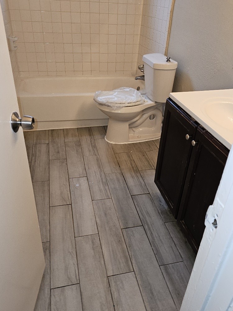 6815 Beachwood Street, Unit 3 Houston, TX 77021 - Photo 11 of 16 a bathroom with a sink and a toilet