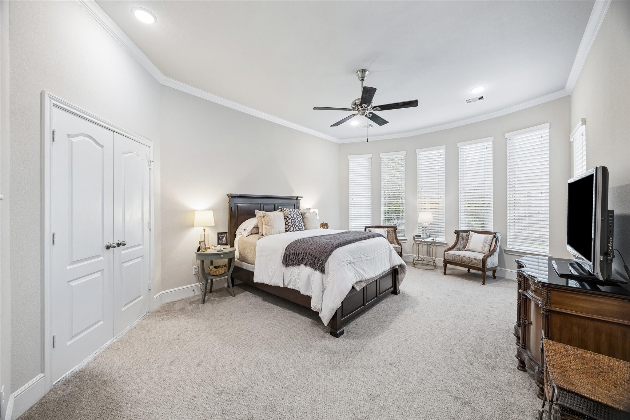 19 Peace Tree Way Tomball, TX 77375 - Photo 23 of 36 Spacious primary suite featuring a picturesque view of the backyard.
