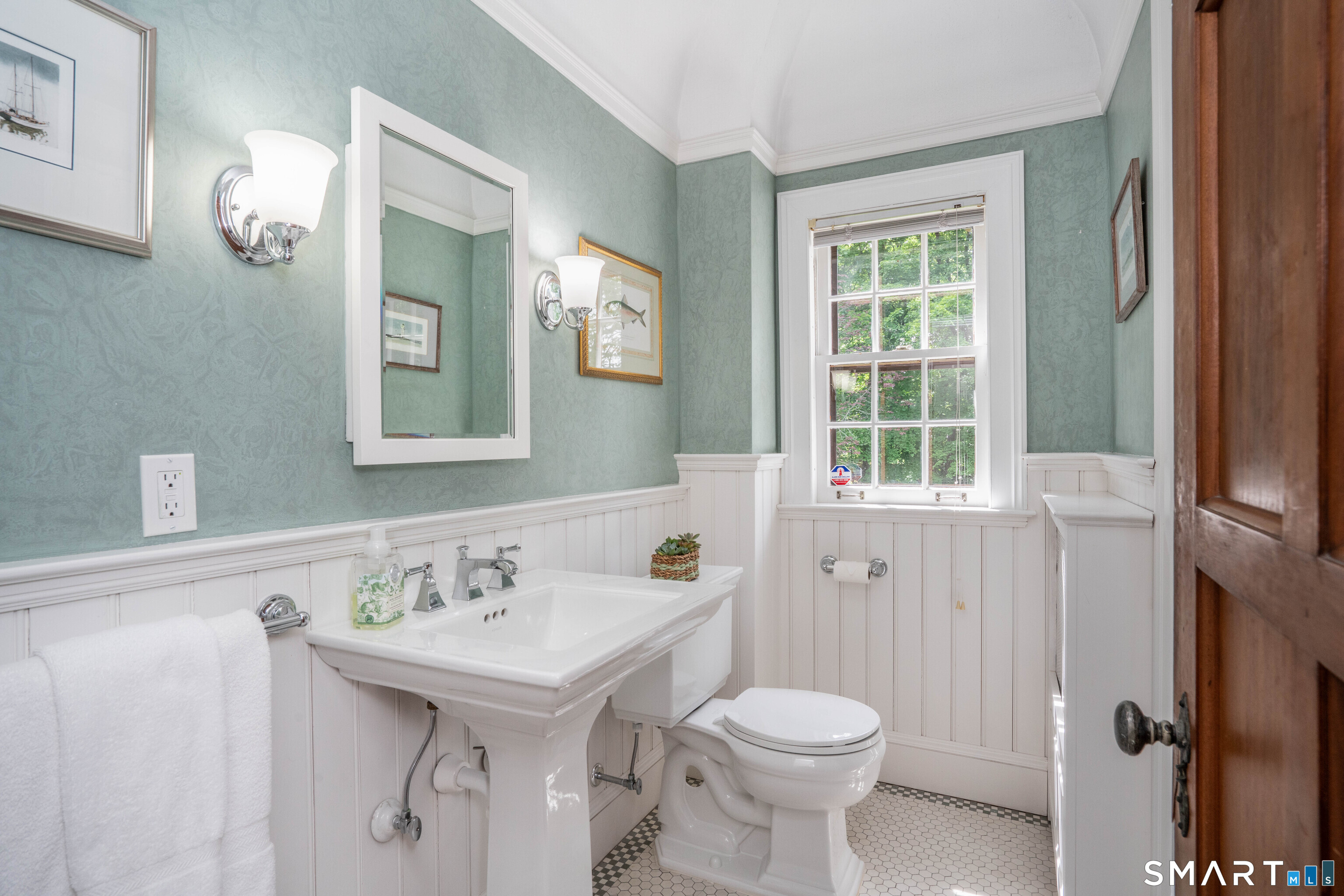 7 Fernwood Road West Hartford, CT 06119 - Photo 28 of 40 a bathroom with a sink a toilet and mirror