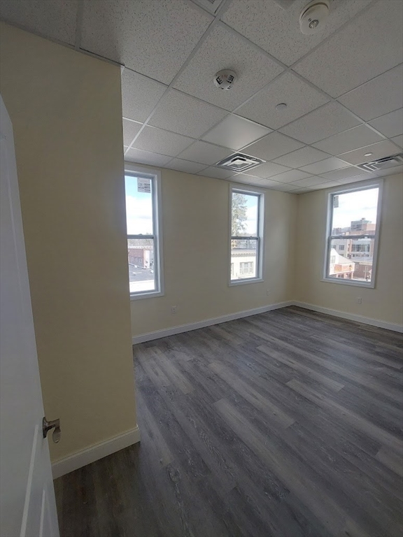 491 Main Street, Unit 11 Athol, MA 01331 - Photo 3 of 10 an empty room with windows