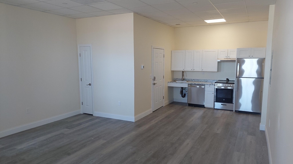 491 Main Street, Unit 11 Athol, MA 01331 - Photo 7 of 10 a view of kitchen with wooden floor