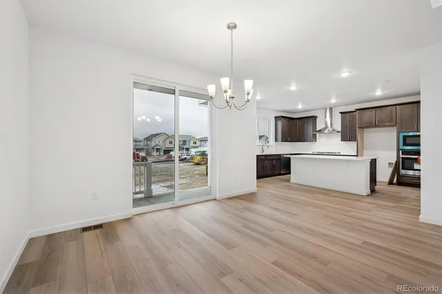 a view of a kitchen with microwave and cabinets