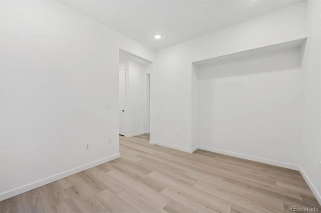 a view of room with wooden floor