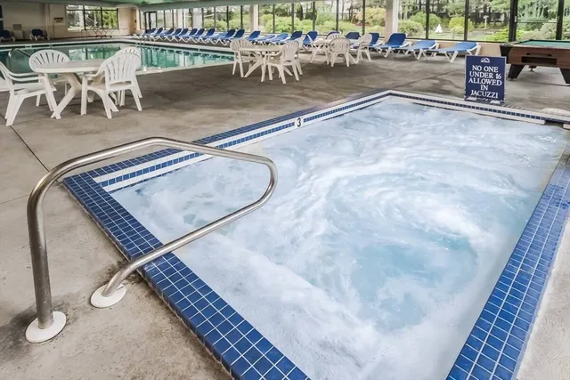 a view of tennis court with trees in the background