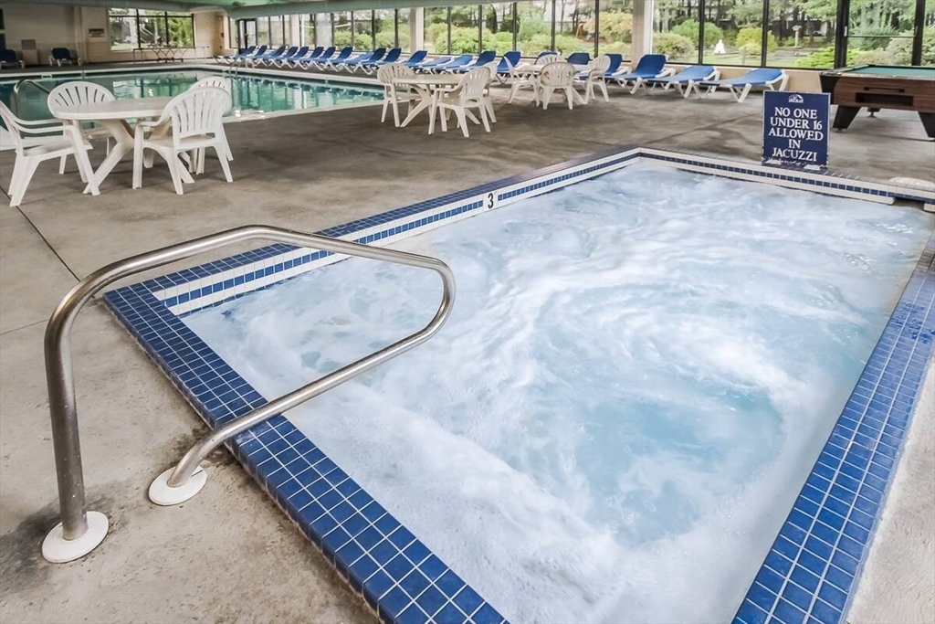 141 Great Neck Road South, Unit 203 Mashpee, MA 02649 - Photo 12 of 16 an outdoor space with patio