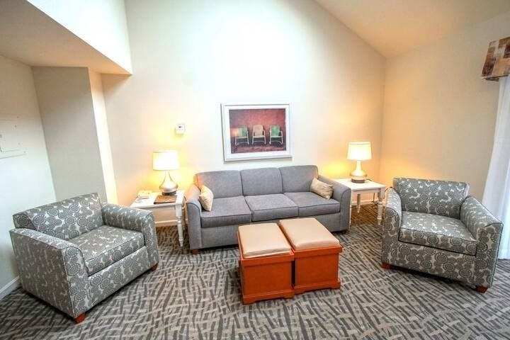 141 Great Neck Road South, Unit 203 Mashpee, MA 02649 - Photo 3 of 16 a living room with furniture and a couch