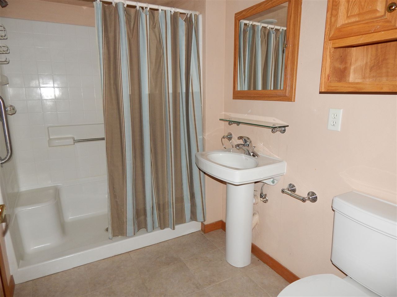 15673 Caledonia Road Caledonia, IL 61011 - Photo 23 of 25 a bathroom with a sink a toilet and shower