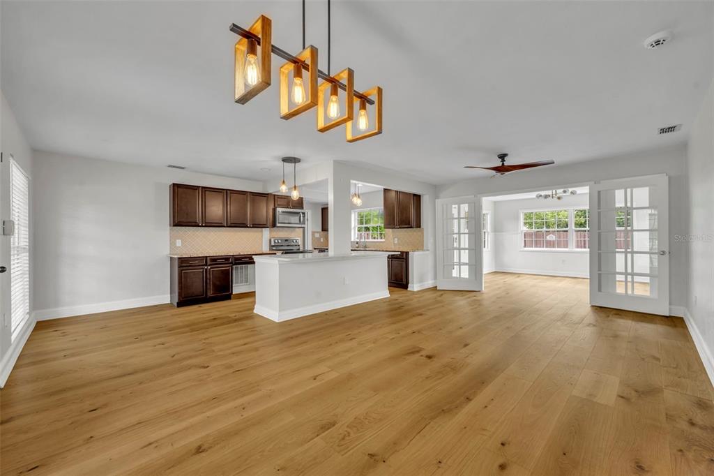 4234 Kendrick Road Orlando, FL 32804 - Photo 5 of 46 a view of livingroom with kitchen and window