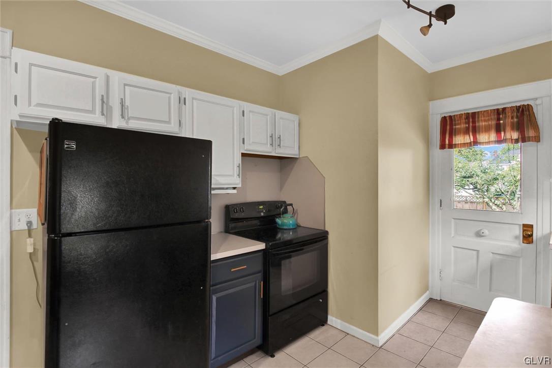 511 Brown Street Stroudsburg, PA 18360 - Photo 13 of 33 a kitchen with a refrigerator and a stove top oven