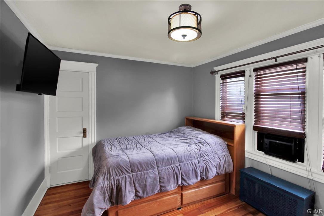 511 Brown Street Stroudsburg, PA 18360 - Photo 15 of 33 a bedroom with a bed and a flat tv screen on the dresser